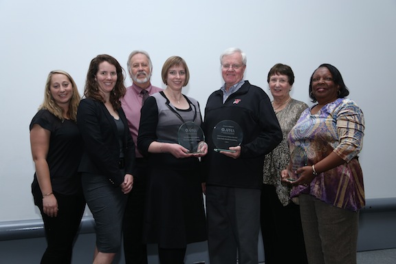 seven people posing with Affiliate award