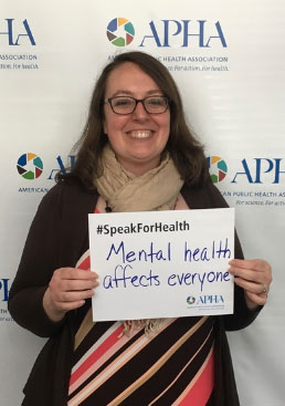 Jessica Pollard holding Mental health affects everyone sign