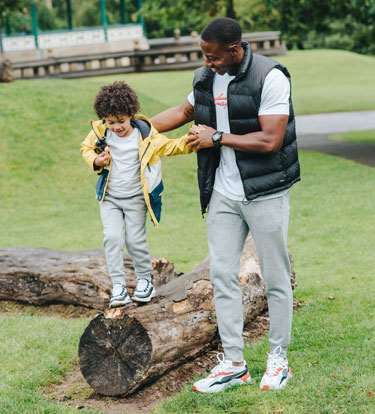 Father playing with son outdoors