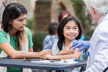 Young girl gets vaccinated