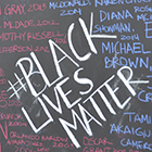 A protest sign that says #Black Lives Matter. 