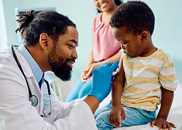 A doctor vaccinates a child