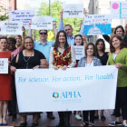 APHA staff holding March for Science signs