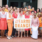 APHA staff with Wear Orange sign
