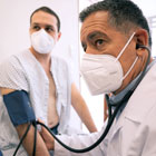 A doctor examines a patient