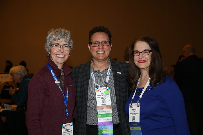 Lisa Carlson with two smiling women
